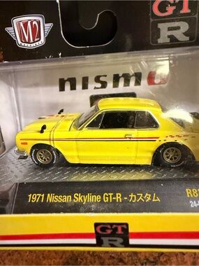 M2 Machines Yellow 1971 Nissan Skyline GT-R Toy Car with Red Stripe